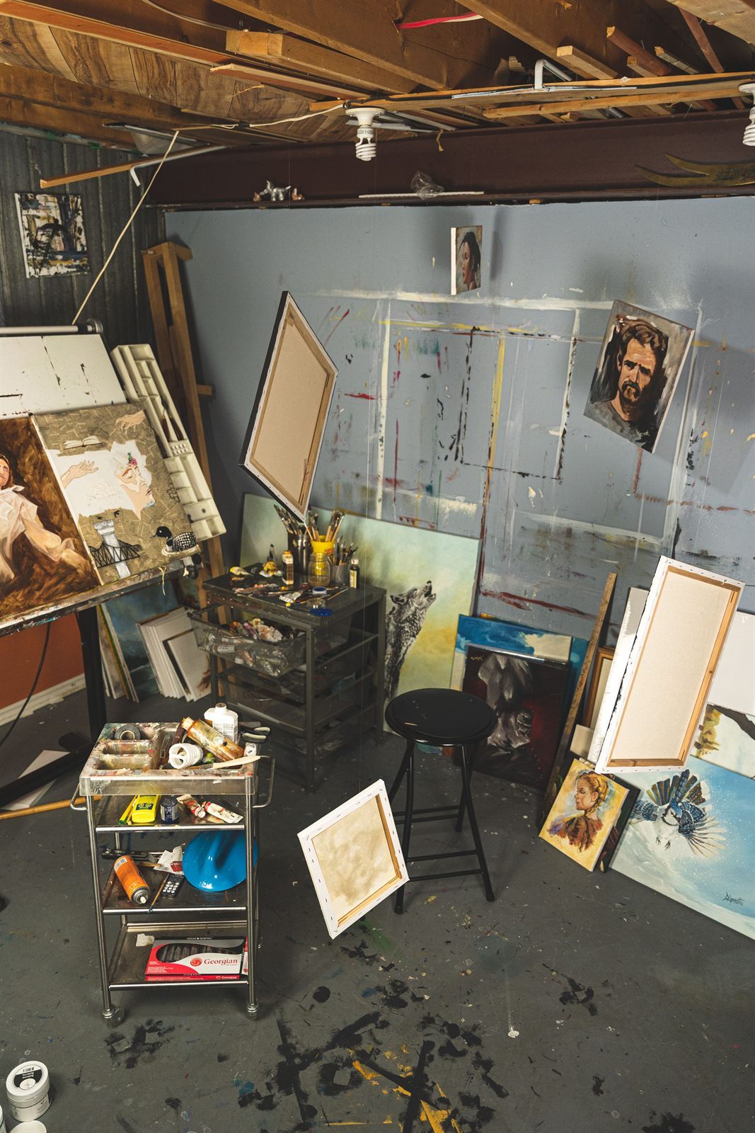 Linda Kane’s studio, with canvases stacked against the walls