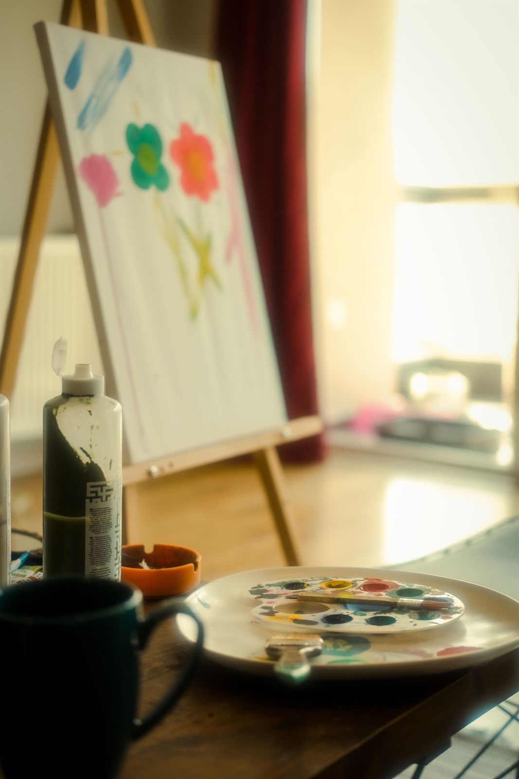 A painting drying on an easel in the studio